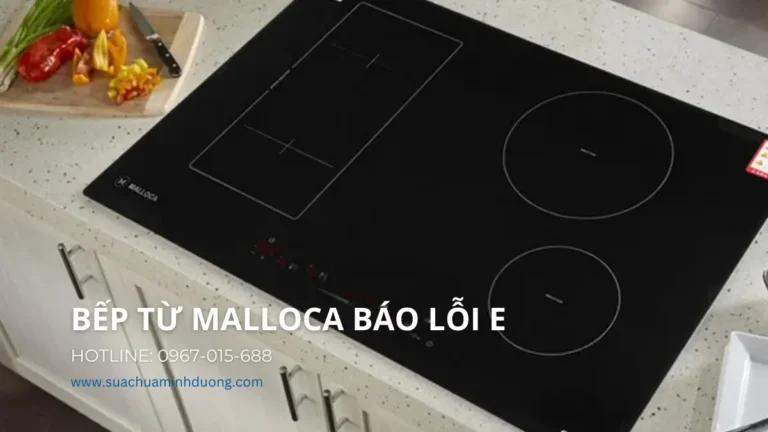 Thợ giỏi của Sửa Chữa Minh Dương đang kiểm tra và sửa lỗi E trên bếp từ Malloca tại nhà khách hàng Hà Nội.